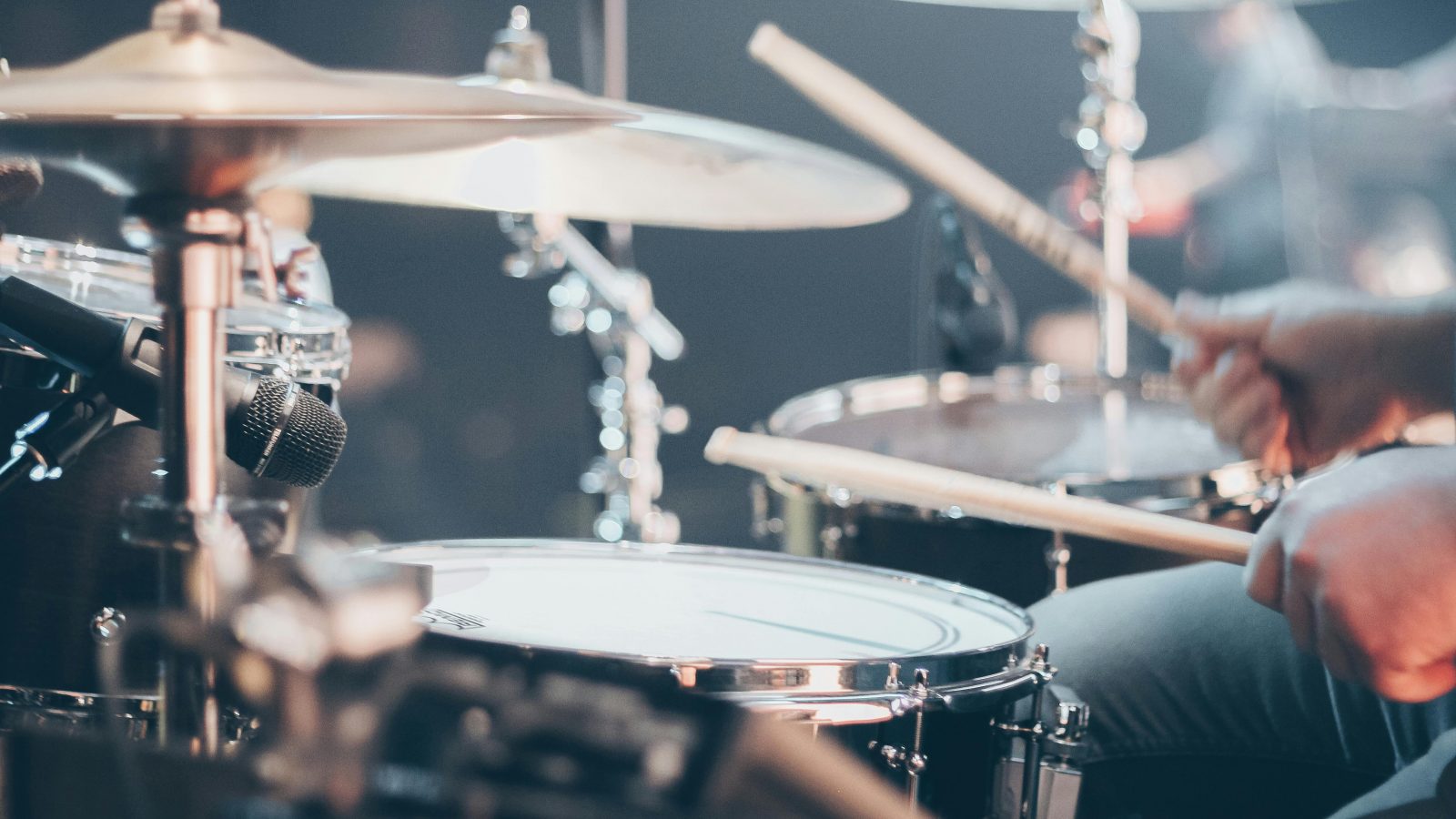 Picture Of Drummer Playing In A Band Scaled Aspect Ratio 1600 900