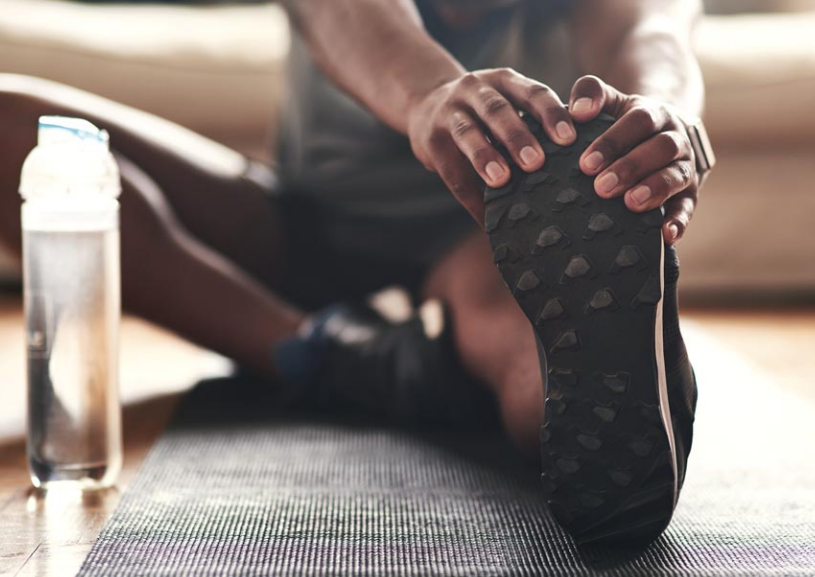 Person warming up for exercise at home